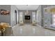 Bright living room featuring tiled floor, natural light, and elegant decor at 10602 Rochester Way, Tampa, FL 33626