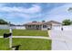 Charming home with a well-manicured lawn, attractive landscaping, and a freshly painted exterior at 10705 Knollsway Ct, Tampa, FL 33625