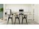 Modern kitchen features white cabinets, stainless appliances, and a large center island with chairs at 10801 Fort White Ct, Tampa, FL 33647