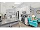 Modern kitchen with granite countertops, stainless steel appliances, and an island with bar seating beneath vaulted ceilings at 11777 90Th Ave, Seminole, FL 33772