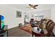 Comfortable living room with an adjacent kitchen view, featuring hardwood floors and bright natural light at 11777 90Th Ave, Seminole, FL 33772
