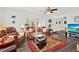 Inviting living room showcasing a comfortable leather sofa, plantation shutters, and contemporary decor at 11777 90Th Ave, Seminole, FL 33772