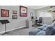 A flexible space featuring sports memorabilia, an open work area, and comfortable furnishings at 11777 90Th Ave, Seminole, FL 33772