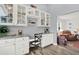 Bright home office area with built-in shelving and a view into the spacious living room at 11777 90Th Ave, Seminole, FL 33772