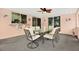 A spacious porch with a ceiling fan and a dining table that is perfect for entertaining at 11777 90Th Ave, Seminole, FL 33772