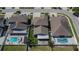 Beautiful aerial view showcasing the home's backyard pool and patio areas at 12664 Flatwood Creek Dr, Gibsonton, FL 33534