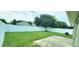 Fenced backyard featuring a grassy area and concrete patio at 12925 Parkington Dr, Gibsonton, FL 33534
