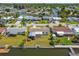 Aerial view showcases waterfront homes, canals, docks, and waterfront living in a well-established neighborhood with landscaping at 13617 Frances Ave, Hudson, FL 34667