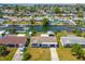 Scenic aerial view of a waterfront community featuring private docks and tranquil canals, near the ocean at 13617 Frances Ave, Hudson, FL 34667