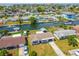 Aerial view of a charming home in a waterfront community, featuring private docks and serene canals at 13617 Frances Ave, Hudson, FL 34667