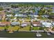 Aerial view featuring waterfront homes with boat docks and waterfront living along canals in an established neighborhood at 13617 Frances Ave, Hudson, FL 34667