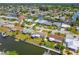 Aerial view of waterfront homes along canals, docks, and waterfront living in an established neighborhood and landscaping at 13617 Frances Ave, Hudson, FL 34667