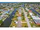 Scenic aerial view of waterfront homes, canals, and docks, highlighting beautiful waterfront living and neighborhood charm at 13617 Frances Ave, Hudson, FL 34667
