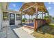 View of a backyard featuring a covered wooden deck, and lush lawn at 13617 Frances Ave, Hudson, FL 34667