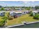 Quaint backyard with a gazebo, enclosed sunroom and canal access at 13617 Frances Ave, Hudson, FL 34667