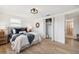 Bright bedroom with hardwood floors, ensuite bathroom and closet at 13617 Frances Ave, Hudson, FL 34667