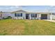 Charming single-story home featuring a well-maintained lawn, attached garage, and a welcoming front entrance at 13617 Frances Ave, Hudson, FL 34667