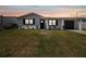 Charming single-story home featuring a well-maintained lawn, attached garage, and a welcoming front entrance at 13617 Frances Ave, Hudson, FL 34667