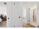 Hallway with view of bedroom and bathroom at 13617 Frances Ave, Hudson, FL 34667