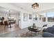 Sunroom with tile floors, table and chairs, and an open view to the other parts of the home at 13617 Frances Ave, Hudson, FL 34667