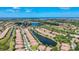 Pictureque aerial view of a stunning residential community with lush landscaping and serene lakes at 146 Shell Falls Dr, Apollo Beach, FL 33572