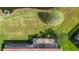 Backyard features a screened lanai, lush green grass and mature landscaping for privacy at 146 Shell Falls Dr, Apollo Beach, FL 33572