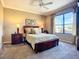 Bright bedroom with large window, king bed, and bedside tables at 146 Shell Falls Dr, Apollo Beach, FL 33572