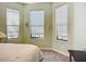 Bedroom featuring multiple windows and neutral tones at 146 Shell Falls Dr, Apollo Beach, FL 33572