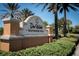 Del Webb Southshore Falls community sign surrounded by lush landscaping and mature palm trees at 146 Shell Falls Dr, Apollo Beach, FL 33572