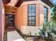 Inviting front entrance with a decorative door, tiled entryway, and vibrant landscaping at 146 Shell Falls Dr, Apollo Beach, FL 33572