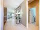 Hallway leading to other rooms, with neutral walls, and tile floors at 146 Shell Falls Dr, Apollo Beach, FL 33572