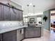 Open kitchen with granite counters and stainless appliances, seamlessly connecting to the living area at 146 Shell Falls Dr, Apollo Beach, FL 33572