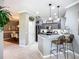 Updated kitchen featuring stainless steel appliances and a breakfast bar, offering a seamless flow into the dining area at 146 Shell Falls Dr, Apollo Beach, FL 33572