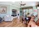 Inviting living room with a modern fireplace, hardwood floors, and a view of the outdoor space at 146 Shell Falls Dr, Apollo Beach, FL 33572