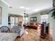 Spacious living room with natural light, hardwood floors, comfortable seating, and access to the outdoor patio at 146 Shell Falls Dr, Apollo Beach, FL 33572