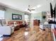 This spacious living room features hardwood floors, comfortable seating, and ample natural light for a welcoming atmosphere at 146 Shell Falls Dr, Apollo Beach, FL 33572