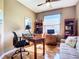 Cozy office space with natural light, desk, and hardwood floors at 146 Shell Falls Dr, Apollo Beach, FL 33572