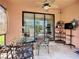 Inviting outdoor patio with comfortable seating and view through the glass doors to indoor living area at 146 Shell Falls Dr, Apollo Beach, FL 33572