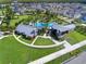 Aerial view of community pool, landscaping, and amenity center at 15429 Caravan Ave, Odessa, FL 33556