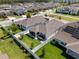 Overhead shot of a fenced backyard with manicured lawn and hot tub on an expansive lot at 15429 Caravan Ave, Odessa, FL 33556