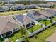 Aerial view of the house, highlighting its solar panels, backyard, and neighborhood at 15429 Caravan Ave, Odessa, FL 33556