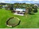 Backyard includes a dog run, pergola and outdoor dining at 15429 Caravan Ave, Odessa, FL 33556