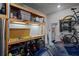 Spacious garage with a workbench, storage shelves and tool storage at 15429 Caravan Ave, Odessa, FL 33556