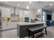 Spacious kitchen featuring an island with seating and modern stainless steel appliances at 15429 Caravan Ave, Odessa, FL 33556