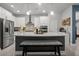 Modern kitchen with stainless steel appliances, center island, and decorative backsplash at 15429 Caravan Ave, Odessa, FL 33556