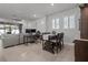 Open-concept living area with a dining table and comfortable seating at 15429 Caravan Ave, Odessa, FL 33556