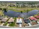 Aerial view of home, highlighting the property's prime location near a lake and golf course at 1806 Wolf Laurel Dr, Sun City Center, FL 33573