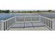 Lake view from a wooden back porch with white rails at 1806 Wolf Laurel Dr, Sun City Center, FL 33573