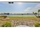 Spacious backyard with a view of the lake and private dock at 1806 Wolf Laurel Dr, Sun City Center, FL 33573