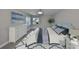 Comfortable bedroom with light gray walls, light-colored floors, and modern décor creating a calming atmosphere at 1806 Wolf Laurel Dr, Sun City Center, FL 33573